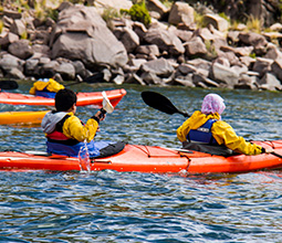 Tourists practicing kayaking in lagoons of Cusco